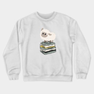 Cute Baby Sheep on top of folded clothes Crewneck Sweatshirt